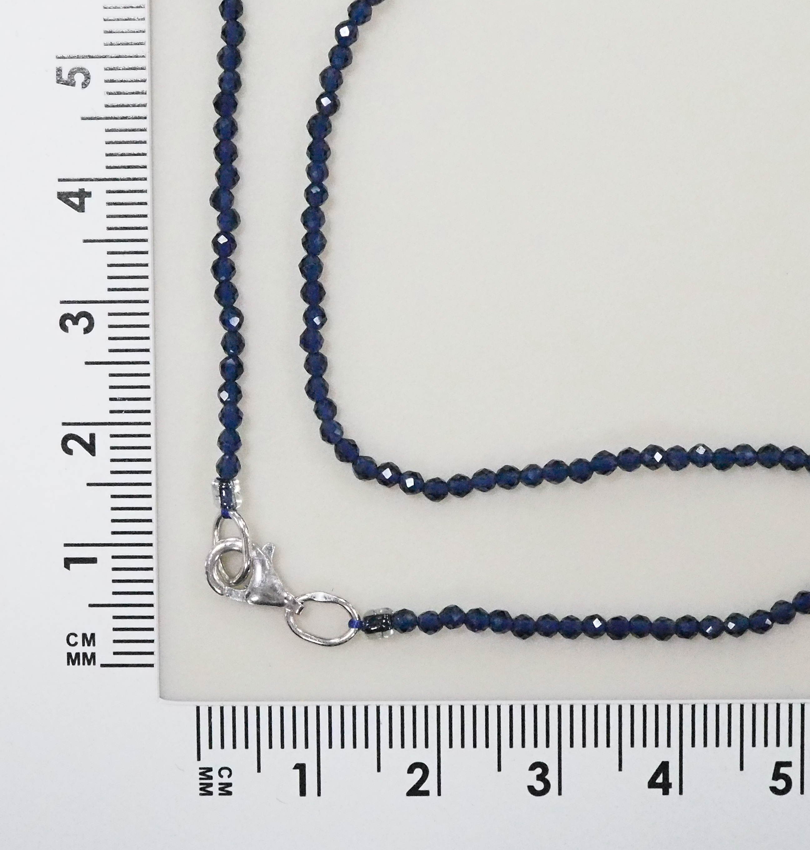 Колье из Шпинели синей;